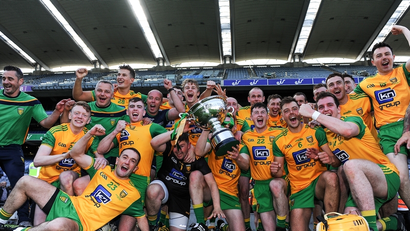 The Donegal team celebrate with the Nicky Rickard Cup