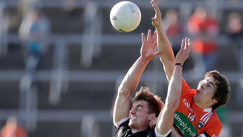 Kevin McDonnell and Andrew Murnin in action