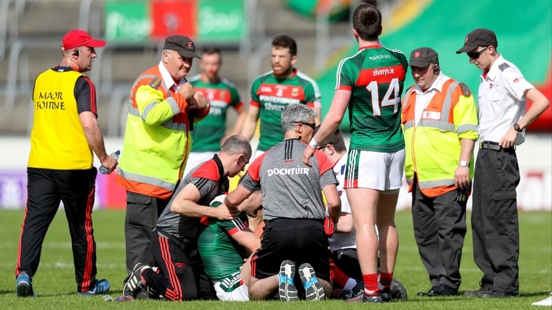 Seamus O'Shea is treated on the pitch