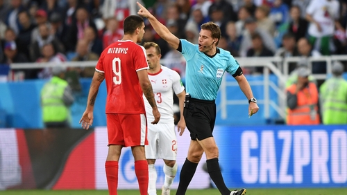 Referee Felix Brych gestures to Aleksandar Mitrovic during Serbia's 2-1 defeat to Switzerland