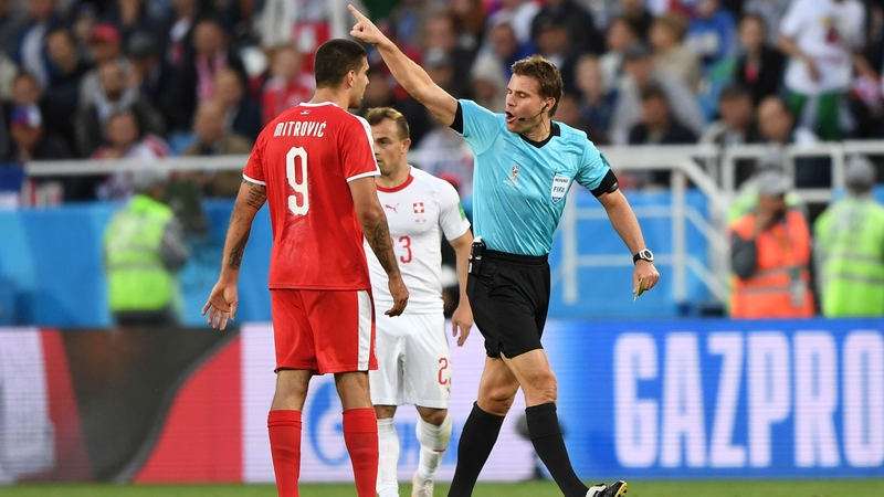 Referee Felix Brych gestures to Aleksandar Mitrovic during Serbia's 2-1 defeat to Switzerland
