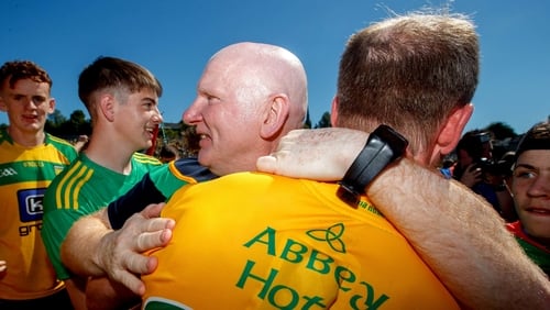 Donegal manager Declan Bonner celebrates with his players at the final whistle