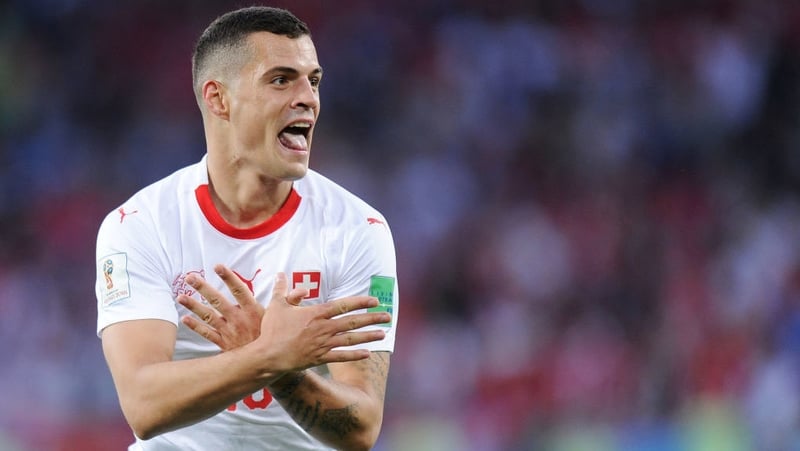 Granit Xhaka celebrating after scoring against Serbia