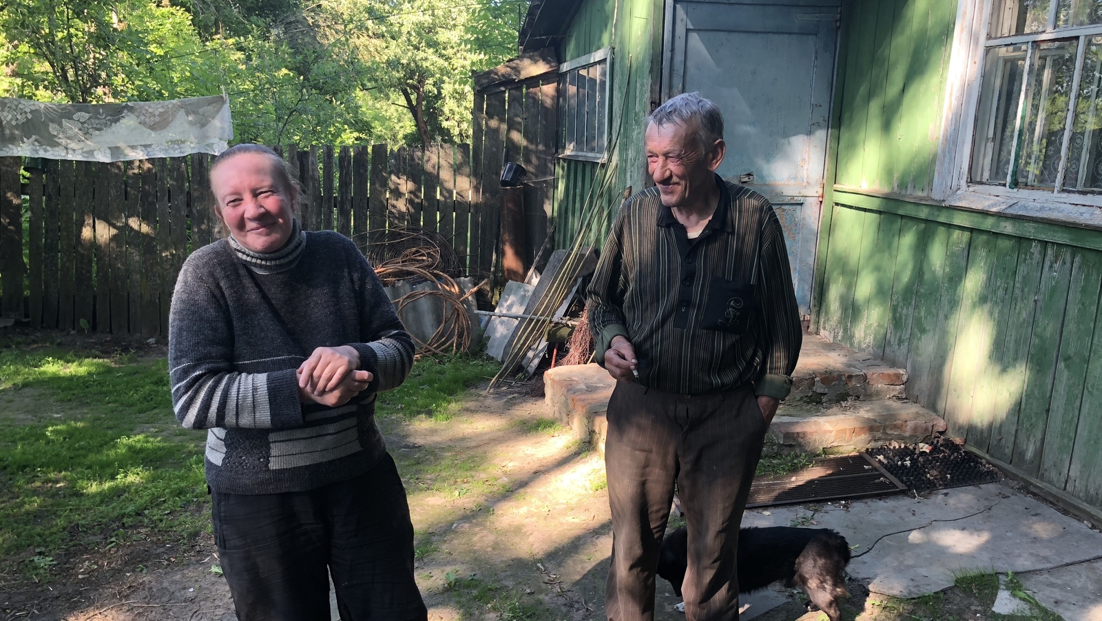 Sveta Shelkunova and Peter Belyakov outside their home in what remains of Bartholomevka village