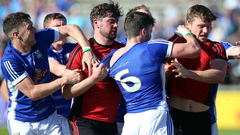 Cavan and Down players clash at the end of the fiery qualifier