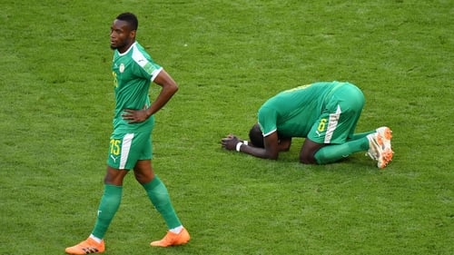Senegal players react following their defeat to Colombia. The Africans became the first team in World Cup history to exit the tournament because of their inferior disciplinary record to Japan