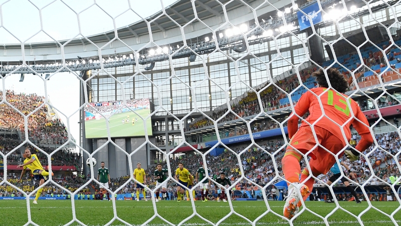 Sweden's Andreas Granqvist scores from the penalty spot past Mexican goalkeeper Guillermo Ochoa