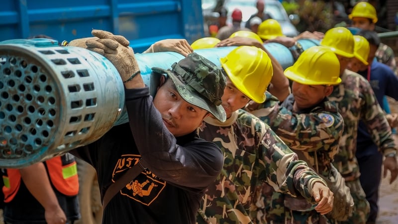 Rescue teams have been pumping out flood waters that have hampered the search effort