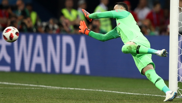 Danijel Subasic saves the first of three penalties in the shootout
