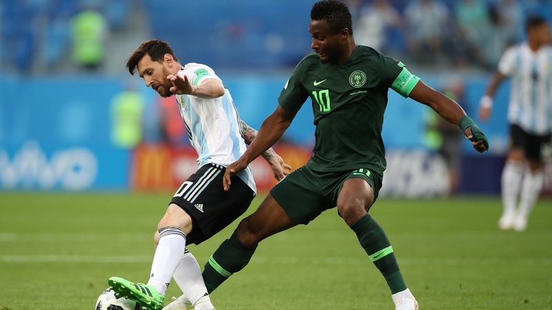 John Obi Mikel attempts to dispossess Leo Messi during the World Cup group game against Argentina