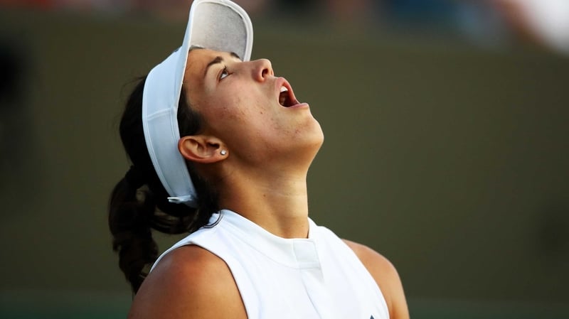 Garbine Muguruza reacts to her shock defeat