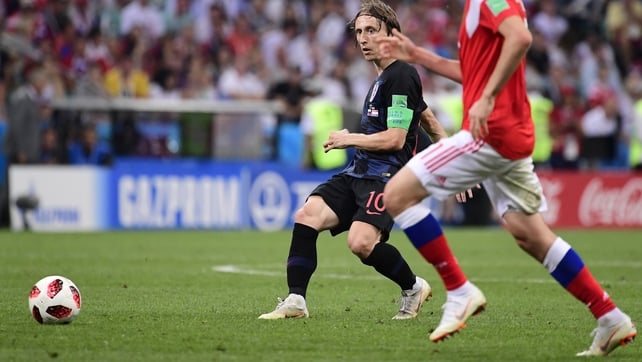 Croatia's midfielder Luka Modric lays off the ball under pressure