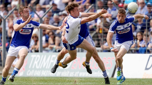 Paul Kingston, Trevor Collins and Kieran Lillis of Laois swarm around Fintan Kelly