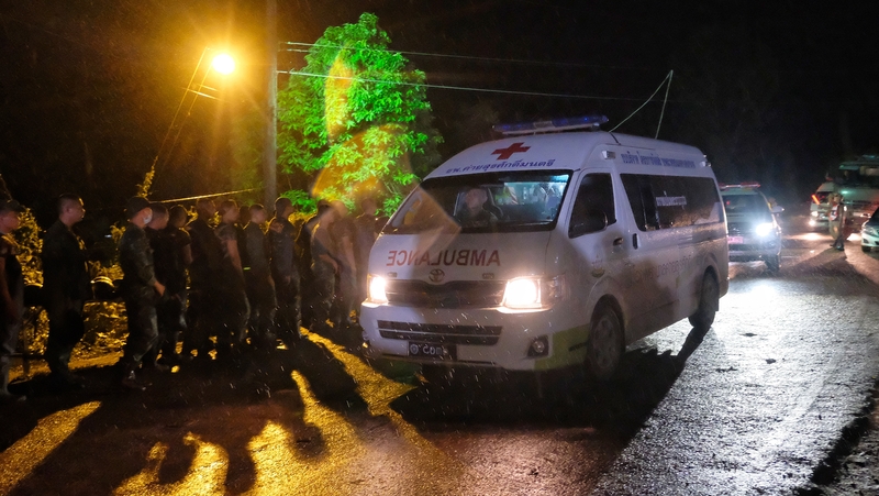 An ambulance leaves the Tham Luang cave area after divers evacuated some of the boys