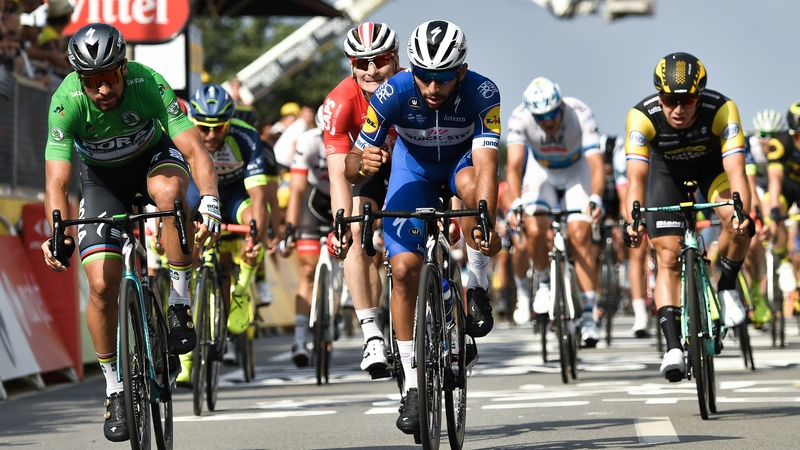 Colombia's Fernando Gaviria celebrates after crossing the finish line