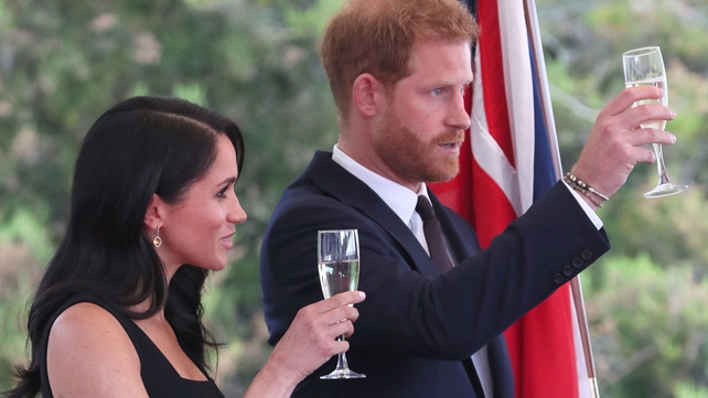 The royal couple offer a toast at the ambassador's residence