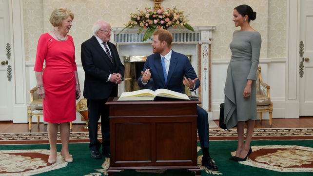 Signing the visitor book at Áras an Uachtaráin