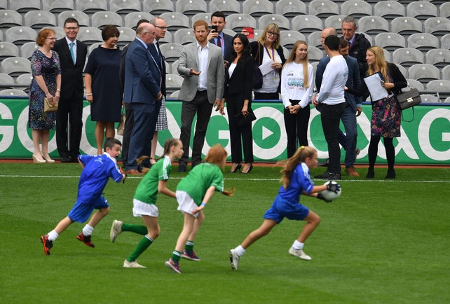 The Duke and Duchess of Sussex watch children demonstrate their football skills at Croke Park