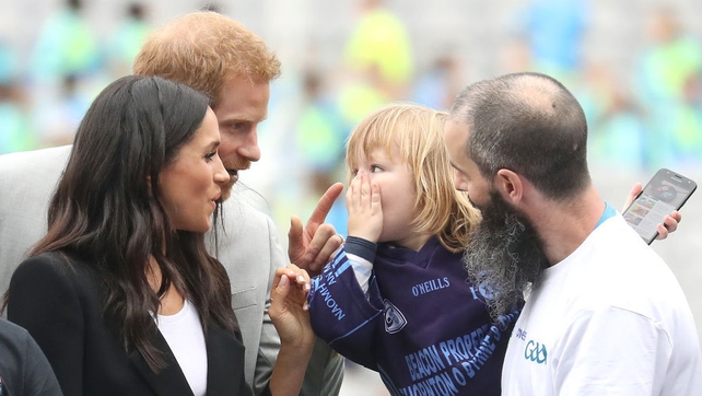 Three-year-old Walter Cullen has some fun with the couple