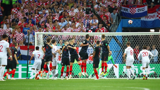 As the ball flies into the net