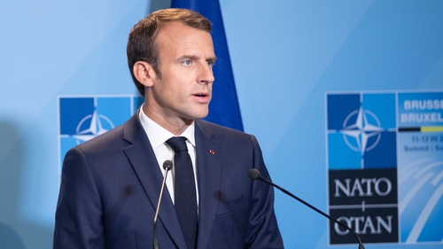 President Macron said spending commitments would remain the same despite Trump's claim of increased budgets