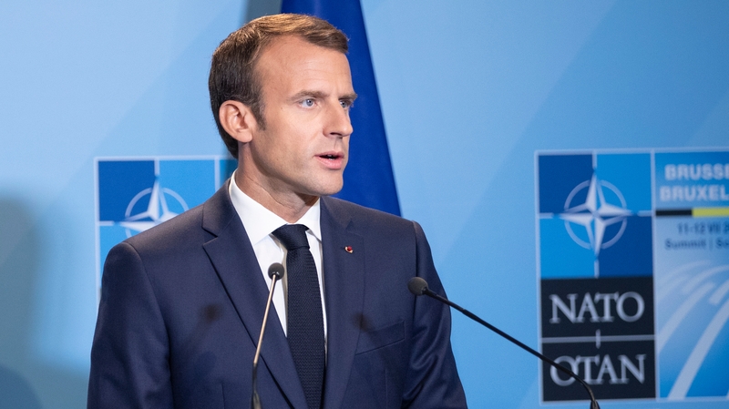 President Macron said spending commitments would remain the same despite Trump's claim of increased budgets