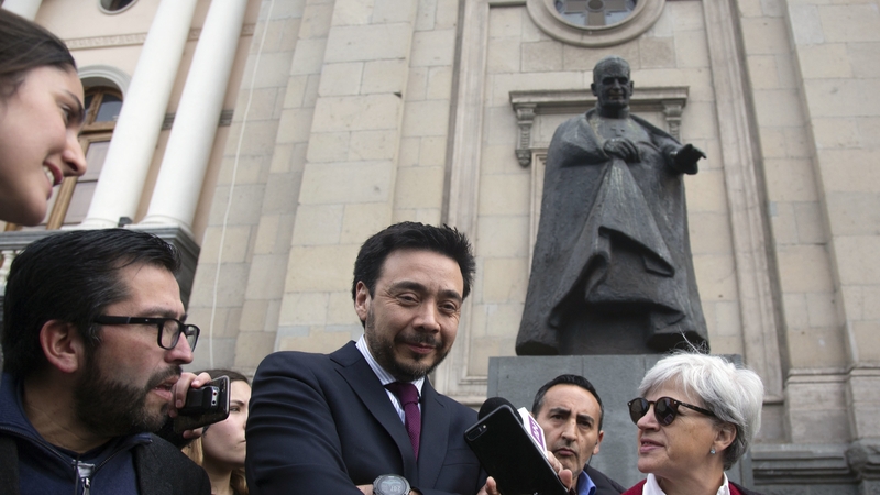 Regional prosecutor Emiliano Arias speaks to reporters in the Chilean capital of Santiago