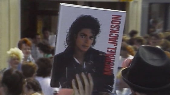 Michael Jackson fan holds folder aloft, Cork city (1988)
