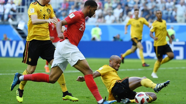 England's midfielder Ruben Loftus-Cheek fights for the ball with Belgium's Vincent Kompany