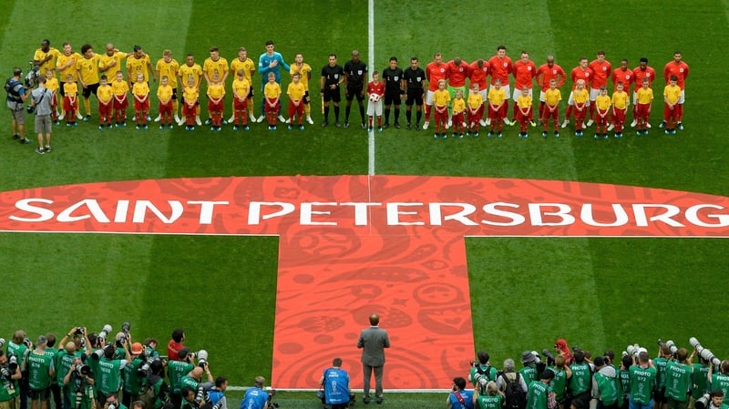 Belgium and England players line up for the national anthems