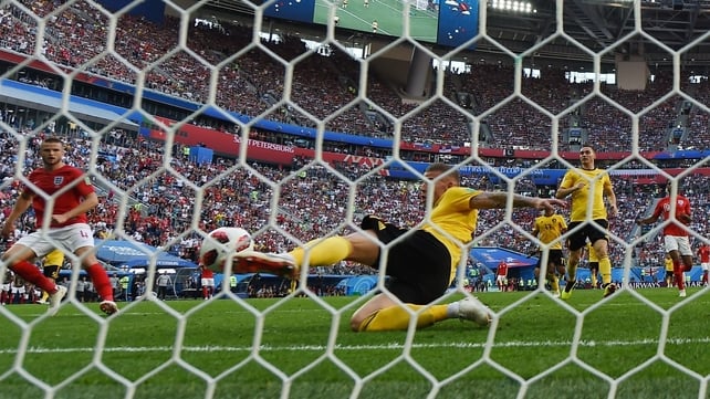 Belgium's defender Toby Alderweireld clears a shot on goal by England's Eric Dier