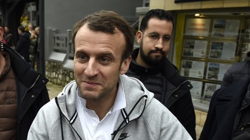 A preliminary investigation has been launched against Alexandre Benalla (seen here behind Emmanuel Macron)