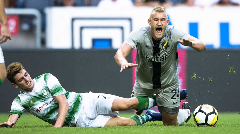 Shamrock Rovers' Dylan Watts tackles Robin Jansson of AIK