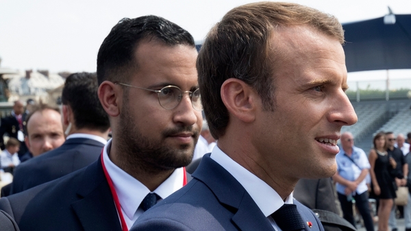 Alexandre Benalla (L) was charged with assaulting a May Day protester