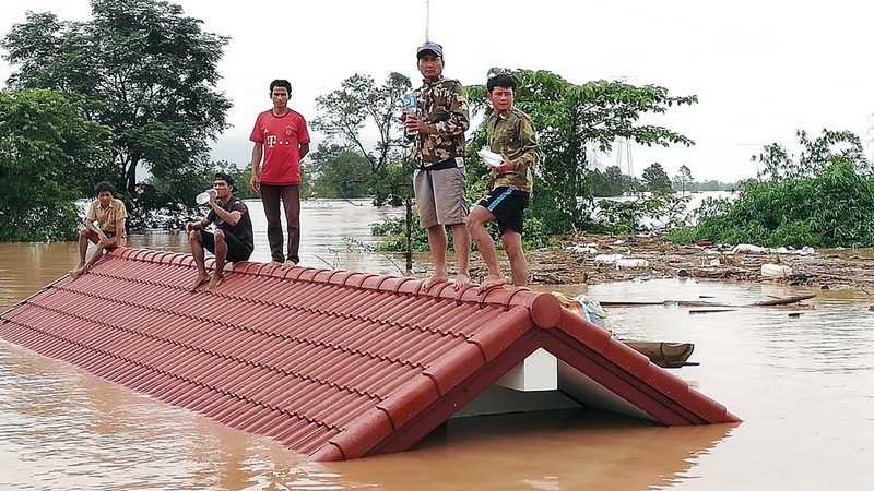 A wall of water was unleashed after parts of the dam were washed away, sending floods surging downstream