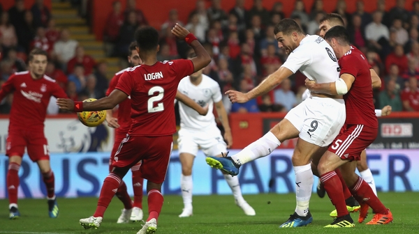 Vokes scores his side's equaliser in Scotland