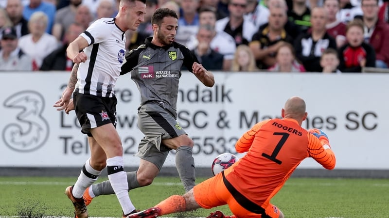 Rogers dives at the feet of Larnaca's Thomas Ioannou
