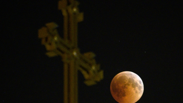 Image of the 'blood moon' taken as it passes over an Armenian Apostolic Church cathedral in Yerevan