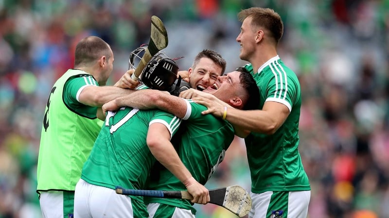 Relieved and delighted Limerick players celebrate at the final whistle