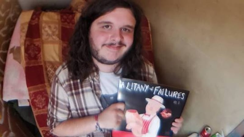 Stevie Lennox with a copy of his new compilation A Litany Of Failures.