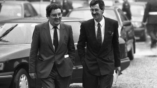 Laughing as he walks with then Labour leader Dick Spring to the inauguration of Mary Robinson in 1990