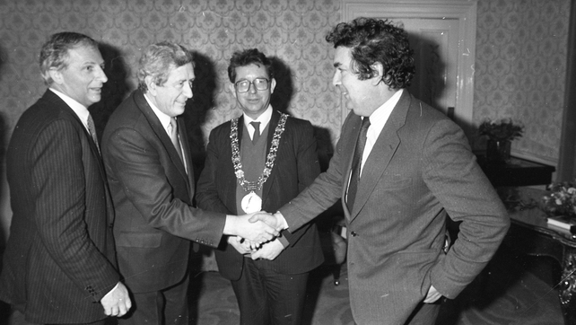 Garret FitzGerald shakes hands with John Hume at the launch of 'John Hume: Statesman of the Troubles' in Dublin in 1985