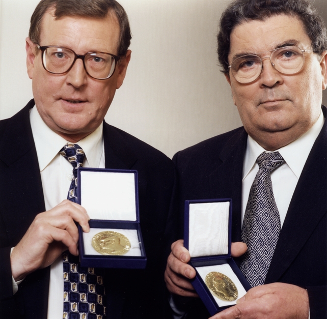 David Trimble and John Hume hold their Nobel Peace Prize awards