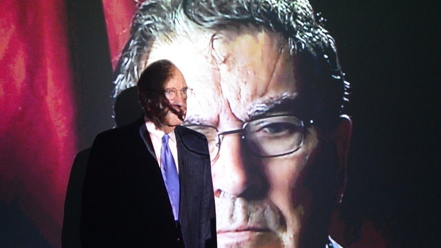 Former US peace envoy to Northern Ireland George Mitchell in front of a John Hume picture at Hugh Lane Gallery in Dublin in April 2018