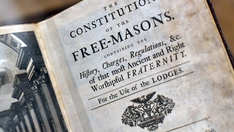 A book by James Anderson titled 'The Constitutions of the Free-Masons' dated 1723