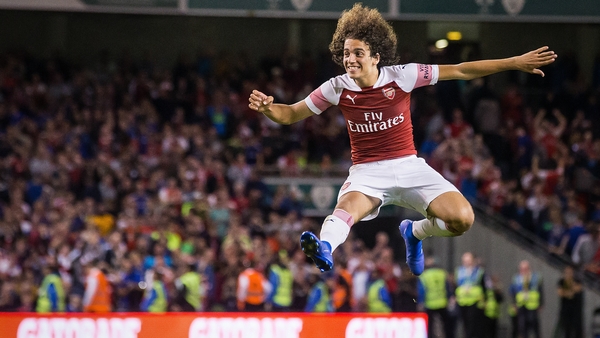 Matteo Guendouzi celebrates winning after Alex Iwobi scores the winning penalty
