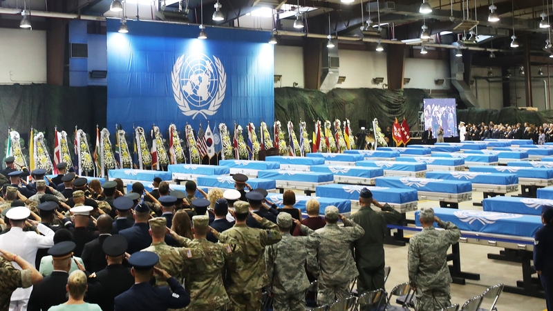 US soldiers salute during the repatriation ceremony at Osan Air Base in South Korea