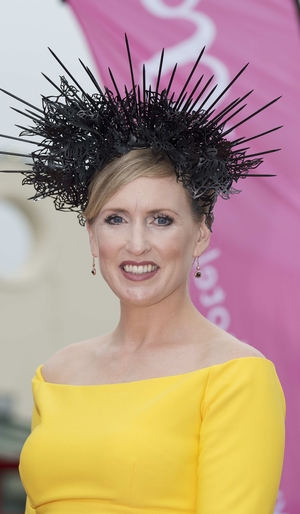 Tara Lally shone in yellow. We love that she chose a black hairpiece to stand out from the crowd.