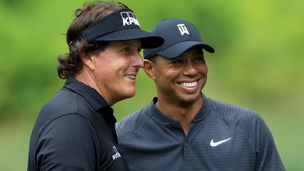 Phil Mickelson (L) and Tiger Woods at the Bridgestone Invitational this week