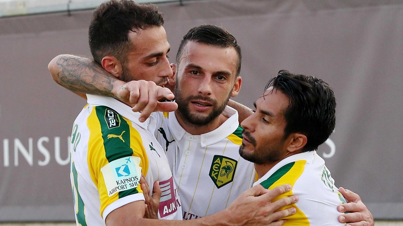 AEK's Ivan Trickovski celebrates his second goal with teammates